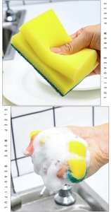 Close-up of double-sided kitchen sponge showing rich foaming action and scouring pad