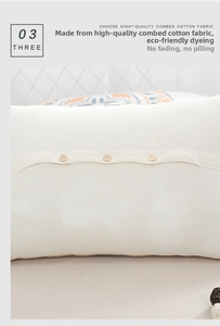 Detail of combed cotton pillowcase with three wooden buttons for secure closure