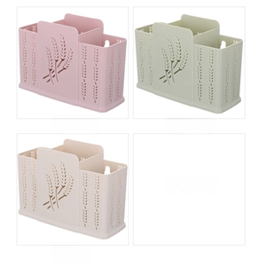 Detail of wall-mounted plastic cutlery holder with wheat pattern in three pastel colors