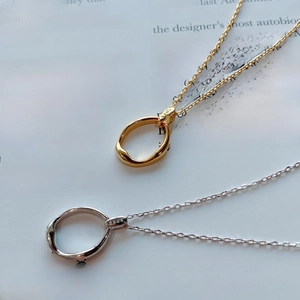 Detailed macro view of S925 sterling silver necklaces with irregular oval pendants