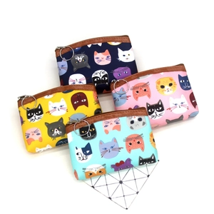Set of four cartoon cat canvas coin purses in navy, yellow, pink, and light blue colors
