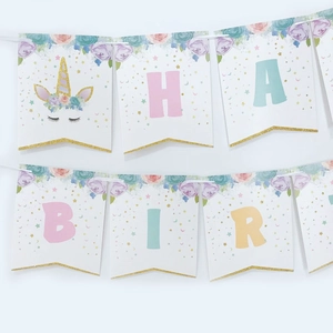 Detail of unicorn birthday banner with glitter letters and gold foil trim on cardstock