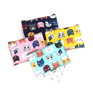Set of four colorful cartoon cat zipper coin purses in navy, yellow, pink and teal