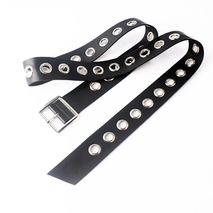 Detail of black PU leather belt with silver square buckle and double row metal eyelets
