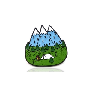 Outdoor camping enamel brooch with snowy mountains forest tent and campfire design