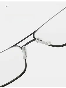 Close-up of soft silicone nose pads and metal bridge on lightweight business reading glasses