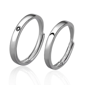 Minimalist adjustable silver rings set with sun and moon engravings for couples