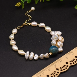 Handmade Baroque freshwater pearl bracelet with deep blue stone and gold chain extension
