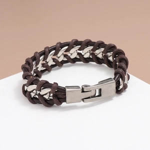 Men's dark brown braided leather bracelet with silver metal chain on beige background