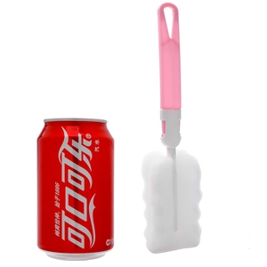 Pink handle sponge bottle brush with wavy foam head and coke can for size reference