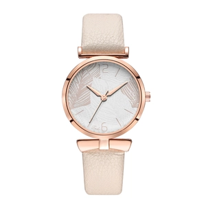 Detail of rose gold quartz watch featuring elegant white leaf texture on the dial