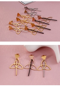 Detail of geometric triangle earrings with hollow knots and hanging metal bars