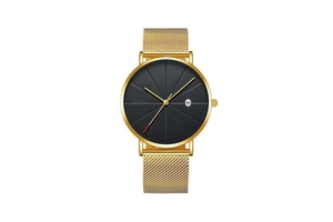 Detailed close-up of a gold Milanese mesh strap watch with a black dial and date display