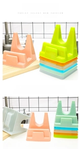 Multi-colored kitchen organizer racks for pot lids and cutting boards with drainage