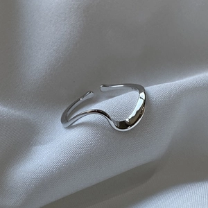 Macro view of adjustable S925 sterling silver Mobius ring with interior hallmark