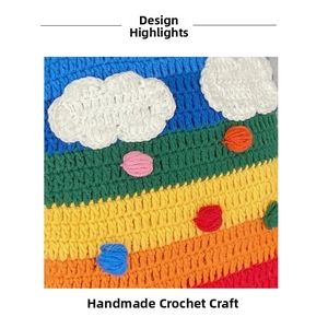 Detailed close-up showing the handmade crochet texture of the rainbow striped knit bag