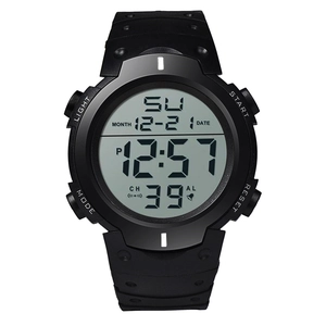 Detailed macro view of black sports watch face showing digital display and function labels