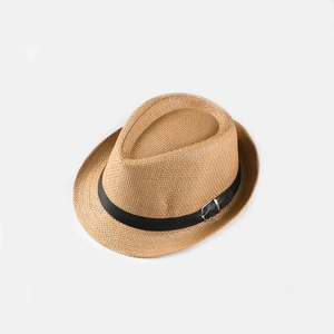 Detailed close-up of straw fedora hat featuring a black leather belt and metal buckle