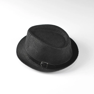 Detailed close-up of woven straw texture and black leather belt with metal buckle