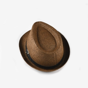Top down view showing the intricate straw weave and black belt detail on the jazz hat