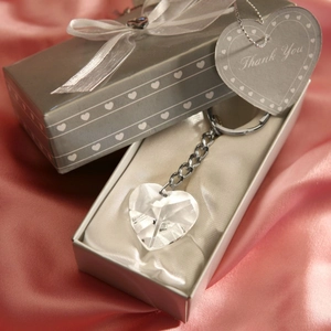 Detailed view of crystal heart keychain in a grey gift box with a Thank You tag