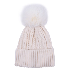 Detail of beige knit baby hat with soft cable pattern and large white faux fur pompom