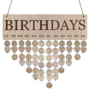 Detail of wooden birthday calendar plaque with hanging round and heart shaped tags