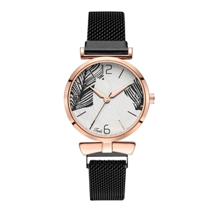 Detail of rose gold case and white dial with leaf print on Tadi quartz watch
