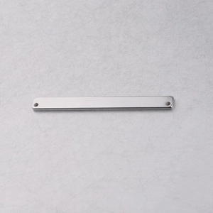 Macro detail of silver rectangular stainless steel connector with two holes for DIY jewelry