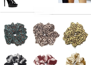 Detail view of oversized hair scrunchies with leopard and tropical leaf prints