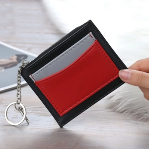 Handheld tri-color leather coin purse with zipper and silver keychain attachment