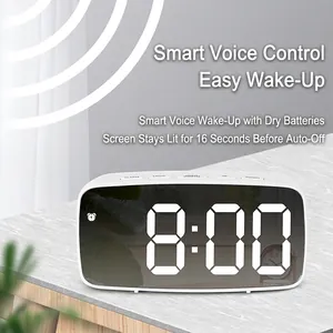 White mirror LED digital alarm clock with voice control and physical buttons on wood