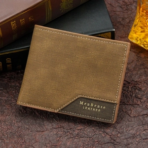 Detail of dark brown matte leather wallet with white stitching and embossed logo