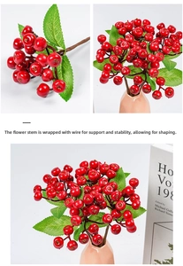 Detail of red winterberry branches with bendable iron wire stem and green leaves