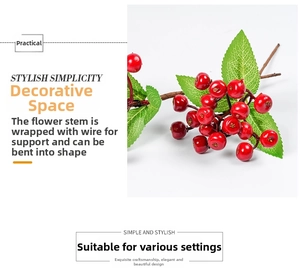 Detailed view of artificial red berries with green leaves and flexible wire stem