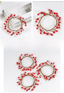 Detail of red and champagne berry candle ring with flexible wire stem for holiday decor