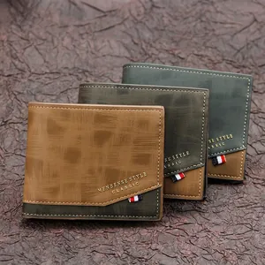 Men's matte bi-fold wallet with brushed texture in brown and green displayed on a vintage desk