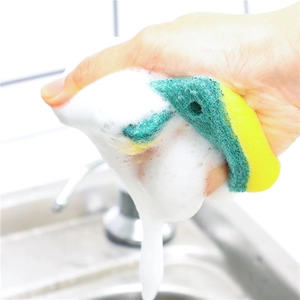 Dual-sided yellow and green cleaning sponge with strong foam lather in kitchen sink