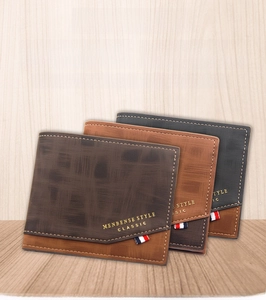 Close-up of three textured leather men's wallets in brown and black with gold branding