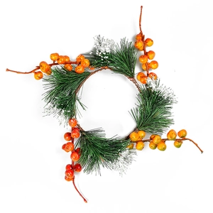 Artificial Christmas wreath with pine needles red berries and snow finish for decoration