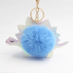 Portachiavi dinosauro pompon blu con scaglie in PU olografico e anello dorato