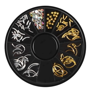 Detailed top view of 12-slot carousel with gold and silver metal nail art decorations