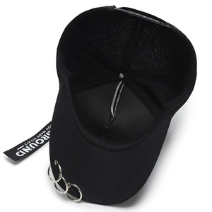 Black cotton baseball cap featuring silver metal rings and hanging ribbon strap decoration