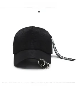 Detail of black hip-hop cap with silver metal rings and WARGROUND printed long ribbon