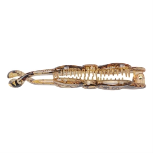 Detail of tortoise shell resin banana hair clip with secure interlocking teeth design