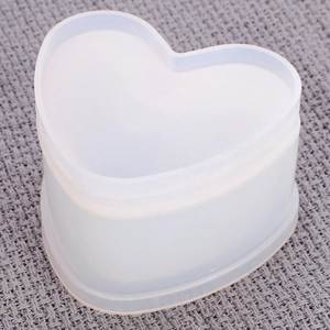 Detailed view of heart-shaped translucent silicone mold for DIY resin jewelry storage