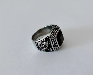 Detailed view of retro steel dragon ring with black square stone inlay on sides