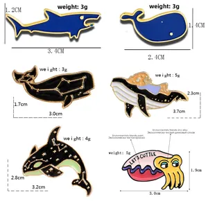 Detailed size chart of six enamel ocean animal pins with whale and shark designs