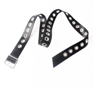 Detail of black PU leather belt with double rows of silver metal eyelets and square buckle