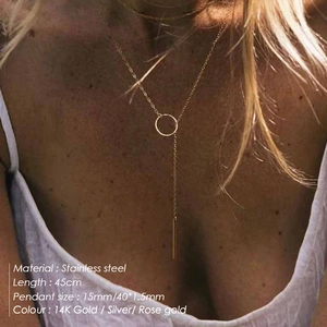 Y-shaped stainless steel necklace with circle and bar pendant on a female model